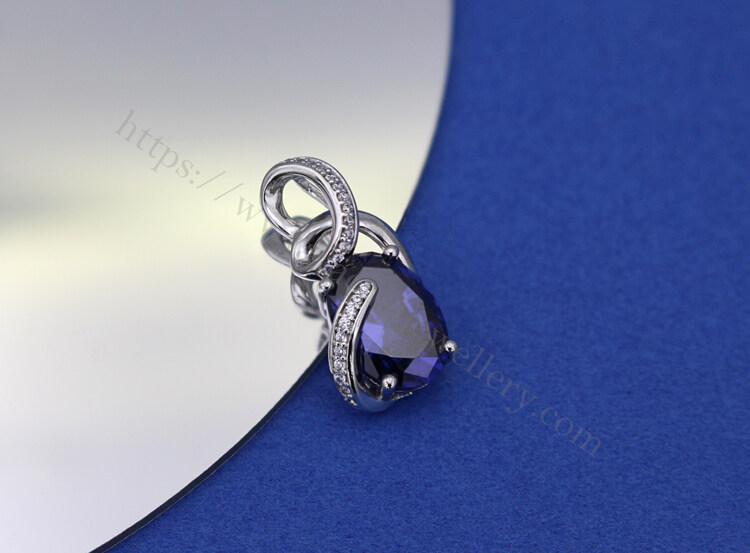 big carat tanzanite stone by hand setting pendant.jpg