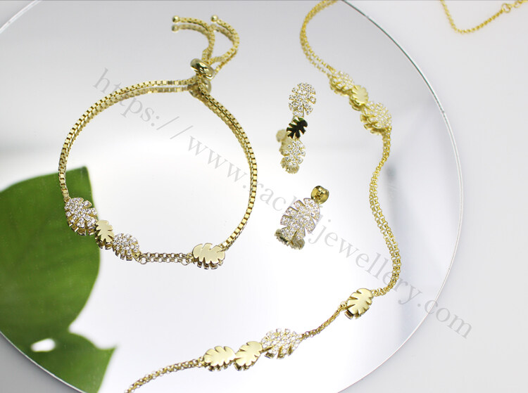 Gold Monstera Leaf necklace factory.jpg