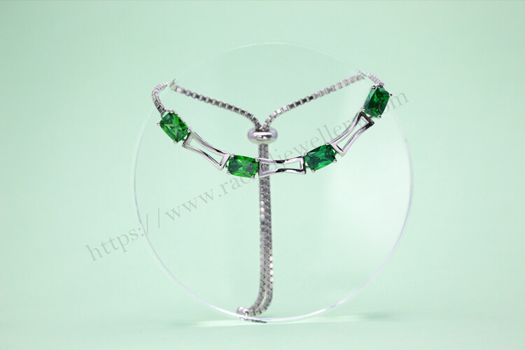 Customized white gold and emerald bracelet.jpg