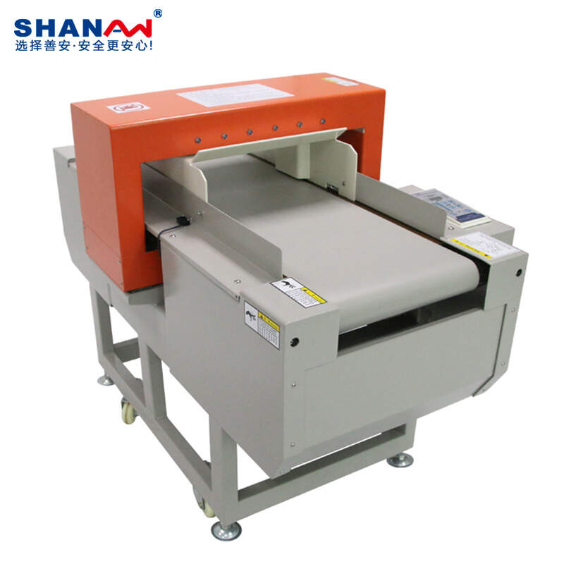 Automatic conveyor needle detector