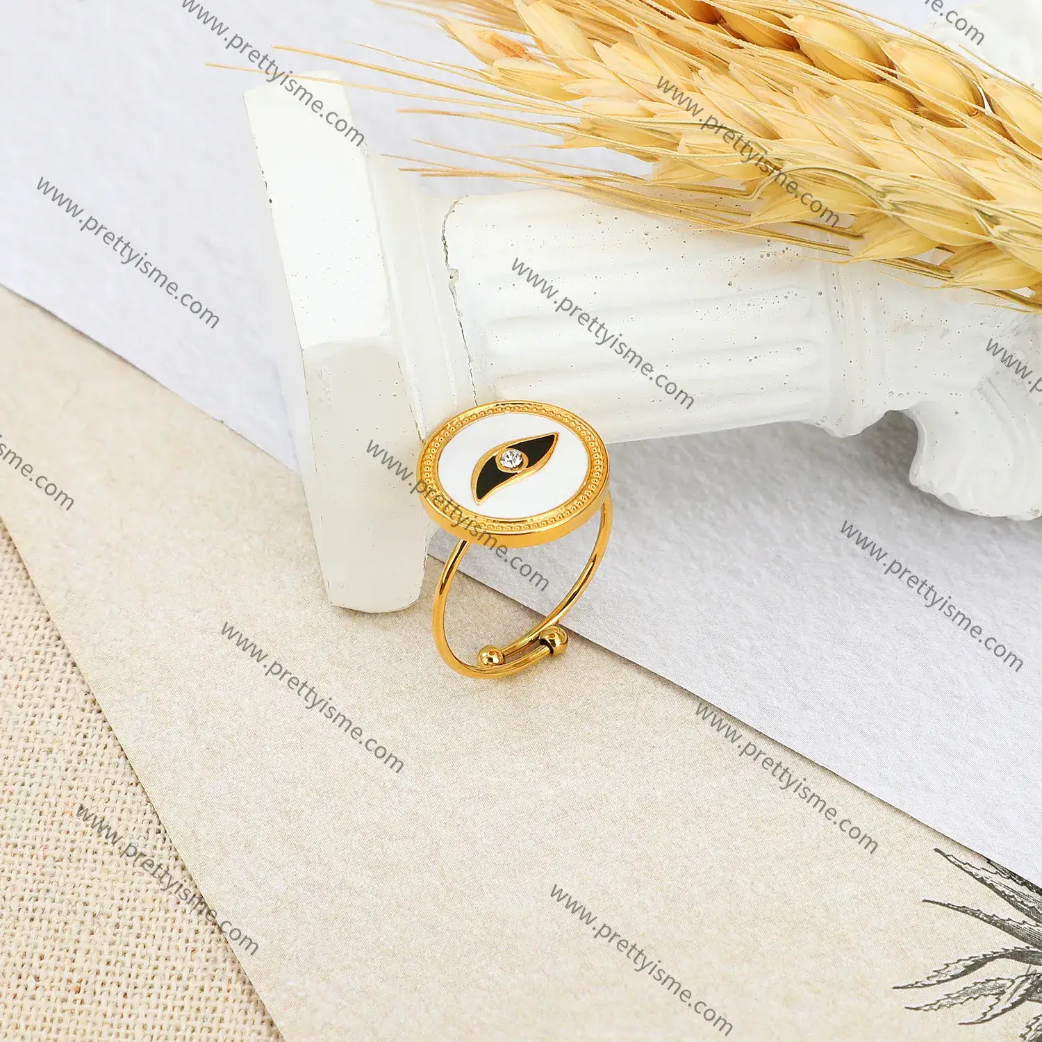 Stainless steel and 18K gold plated abstract eye motif with diamond round open ring (2).webp
