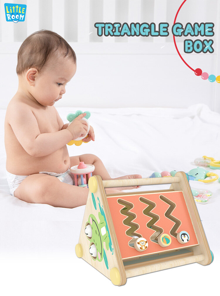 infant playing montessori constructive triangle boxes
