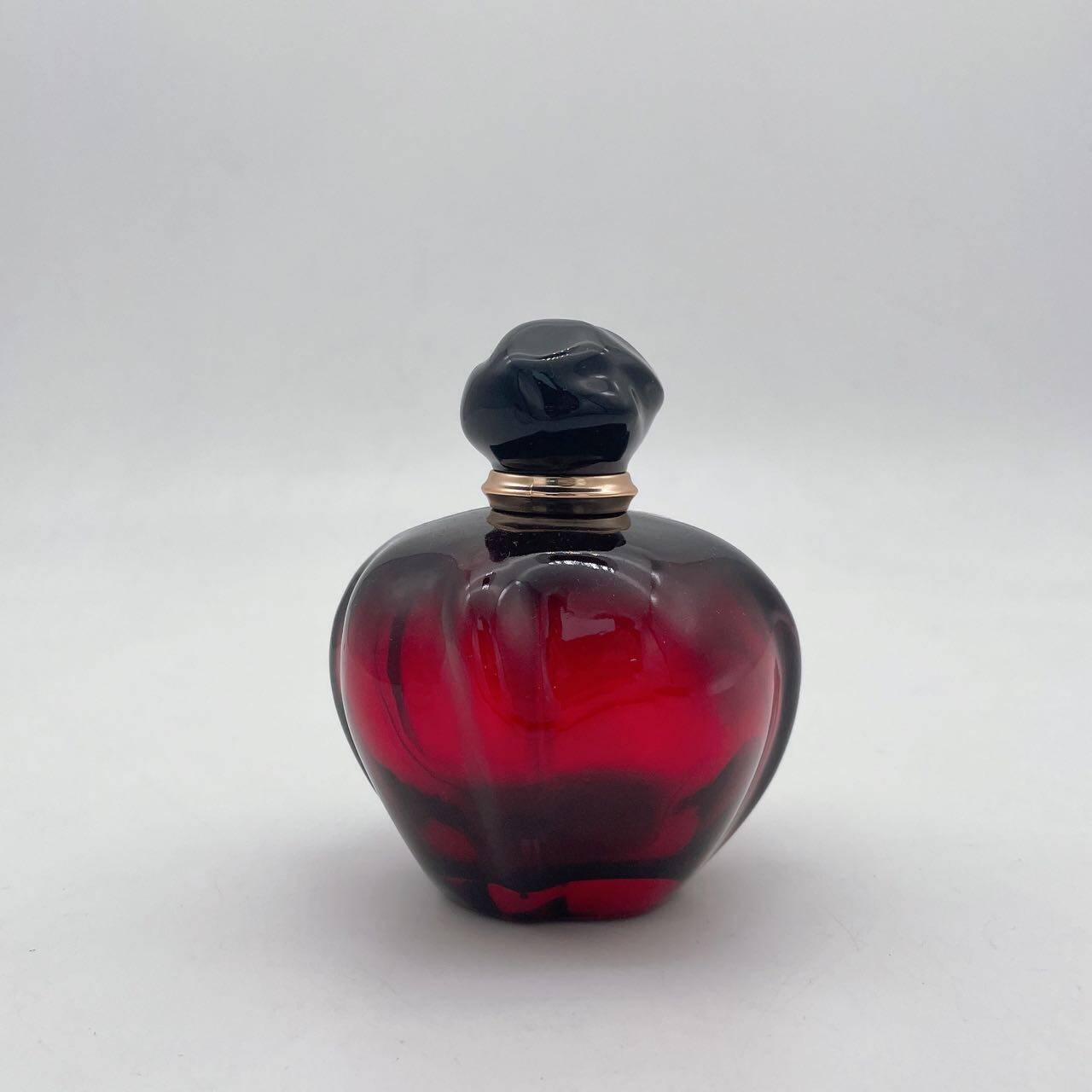 pink colored perfume bottle