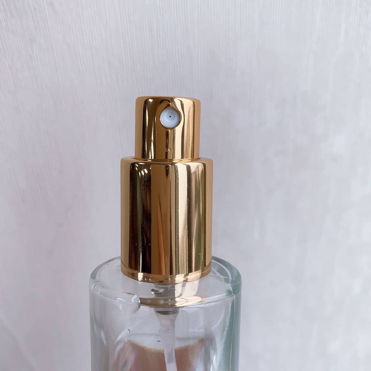 perfume bottle with squeeze pump