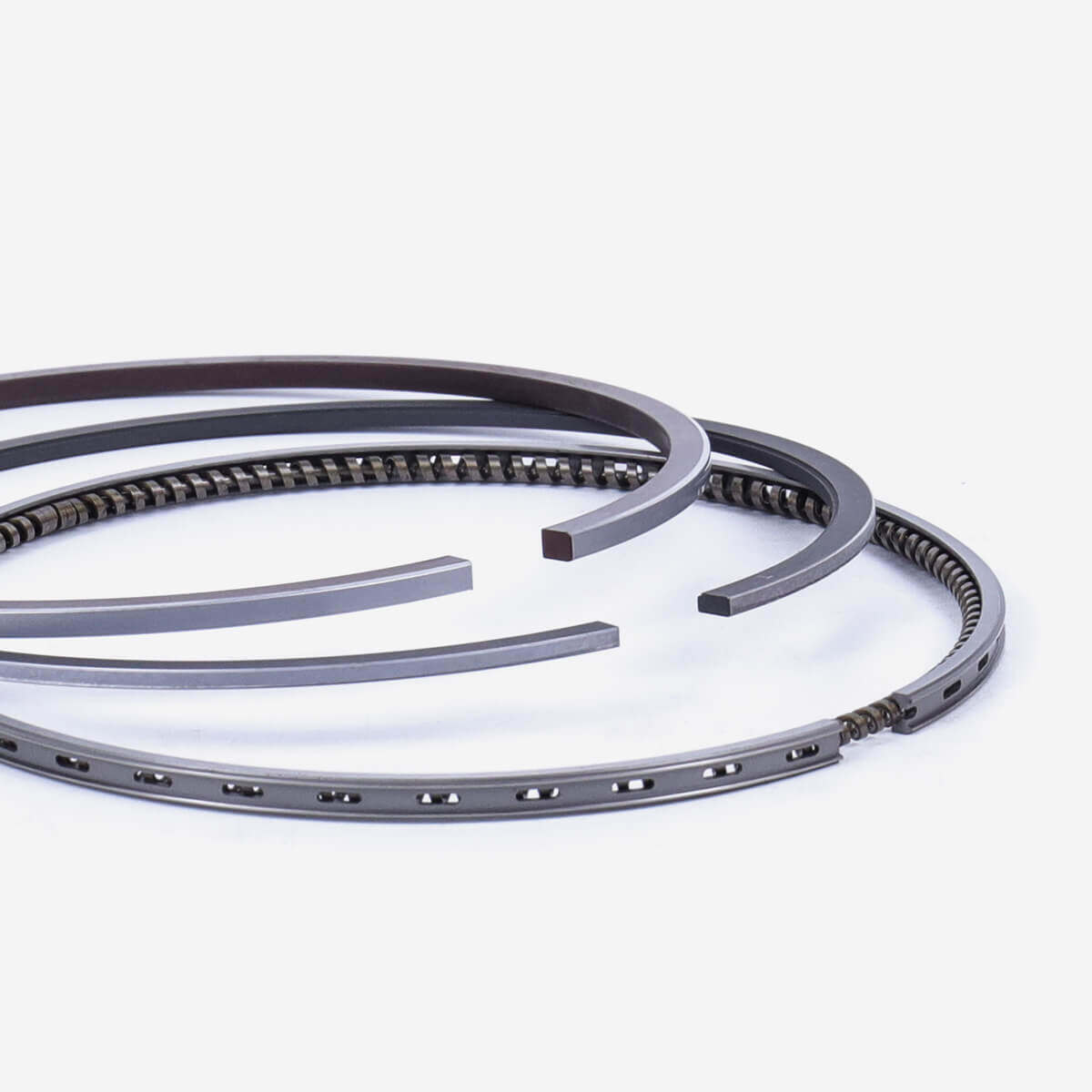 What symptoms occur when a piston ring is damaged?