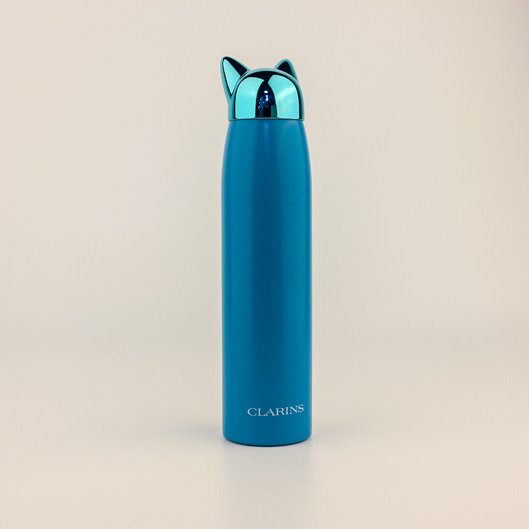 Blue stainless steel water bottle with cat-style top for Clarins
