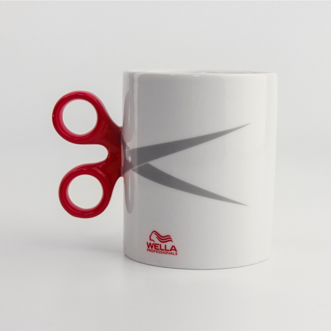 White ceramic mug with a red scissor-shaped handle for WELLA