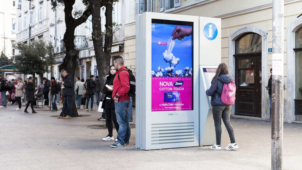 woman-using-imotion-outdoor-digital-signage.jpg