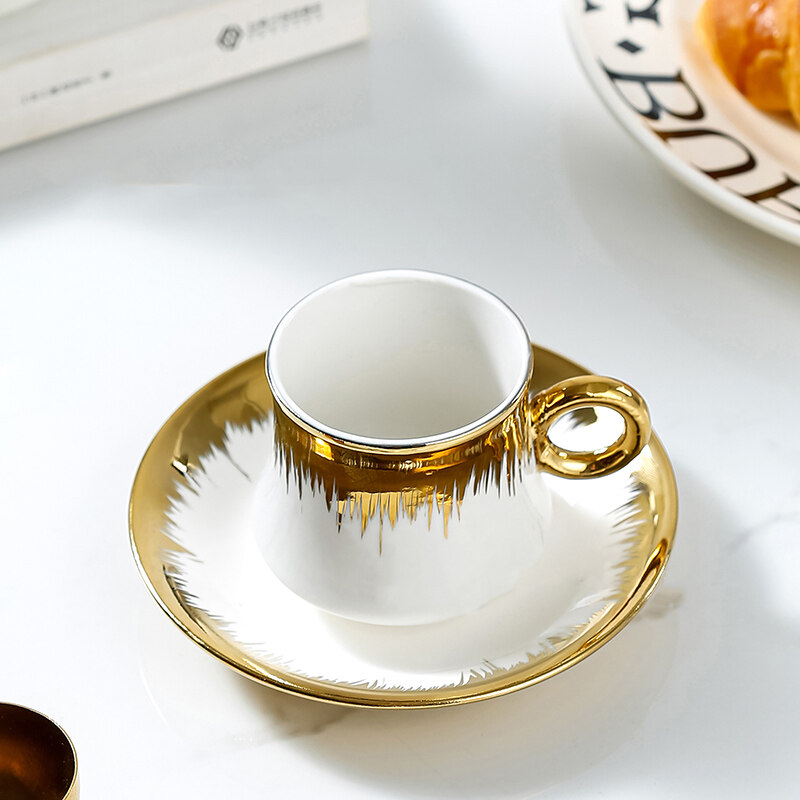 gold cup and saucer; coffee mug set; white and gold coffee cup set