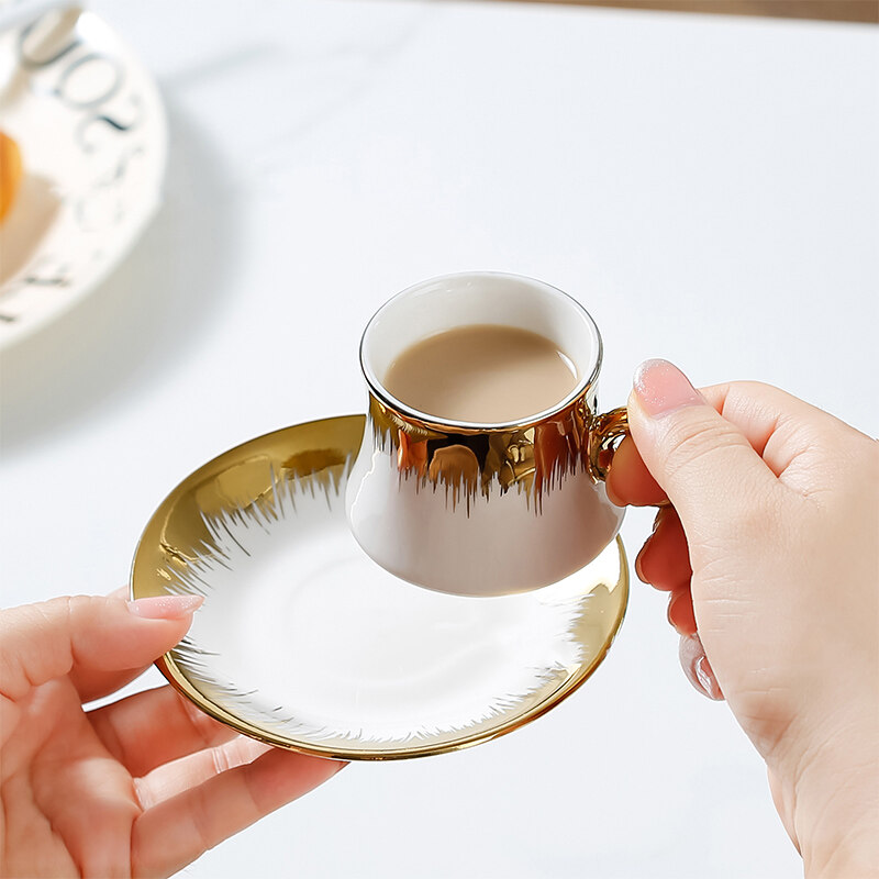 gold cup and saucer; coffee mug set; white and gold coffee cup set