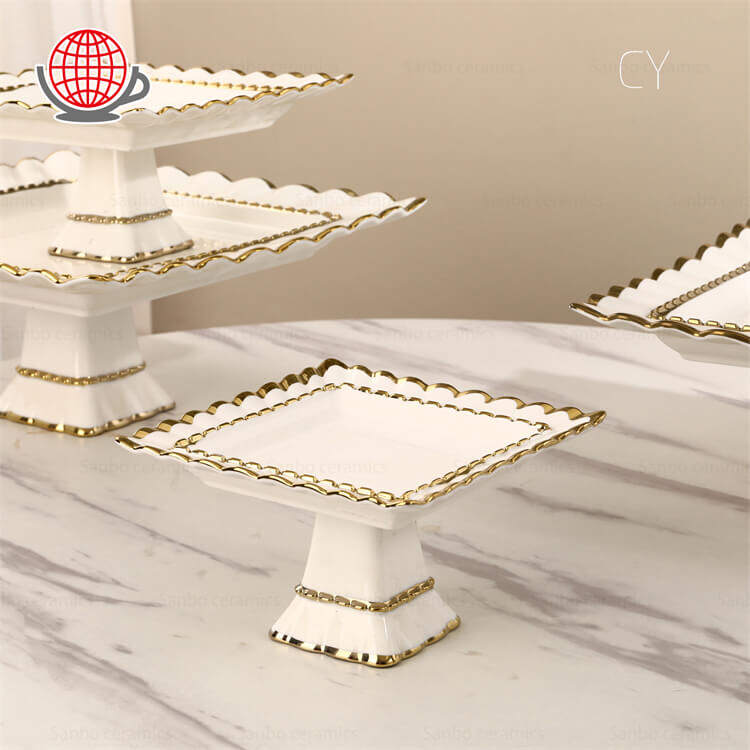 gold-rim-high-footed-cake-stands-for-events.jpg