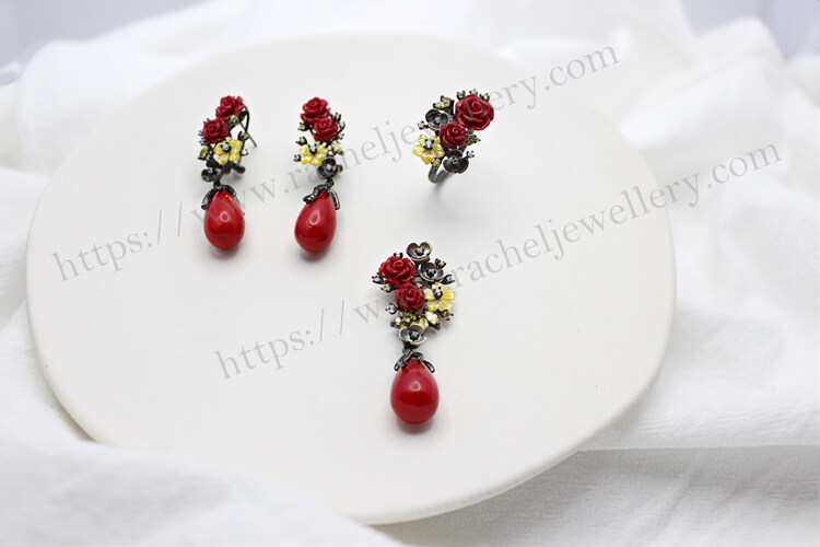 A set of the Camellia sterling silver coral earrings.jpg