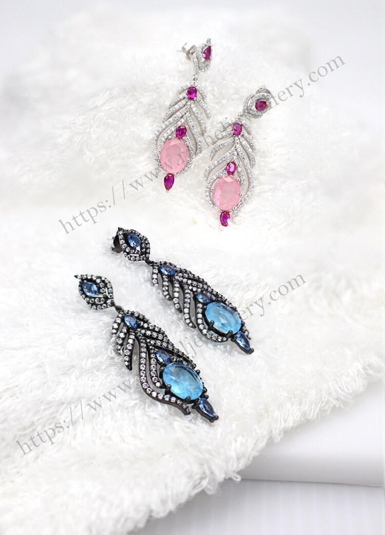 pink and blue peacock feather earrings.jpg
