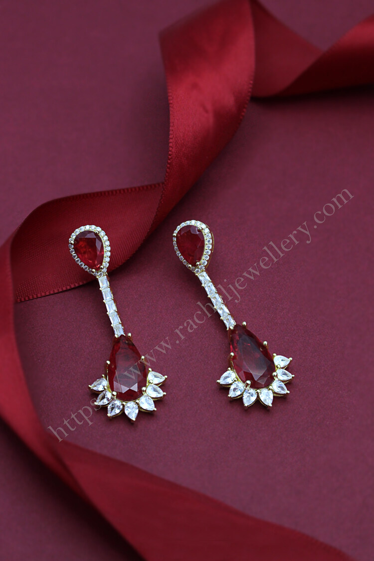 Long baguette pear shaped ruby earrings.jpg