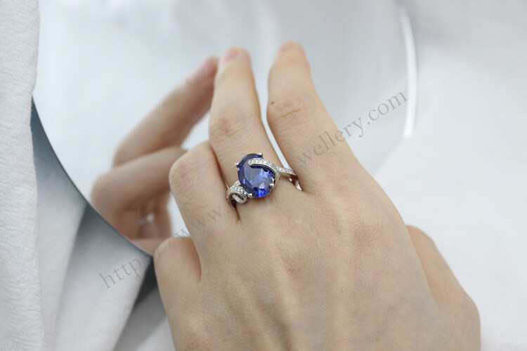 four prong hand tanzanite and sterling silver rings.jpg