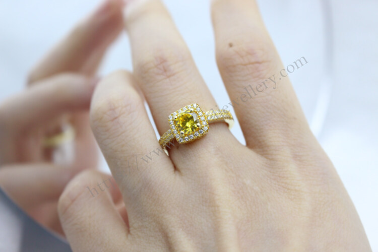 Solitaire yellow carat engagement ring.jpg