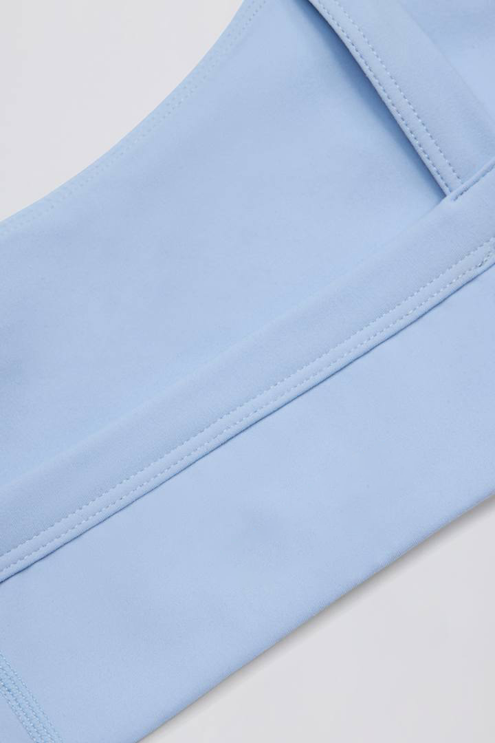 sky blue sports bra, contrast trim yoga bra, soft activewear top, women’s fitness bra, scoop neck workout bra
