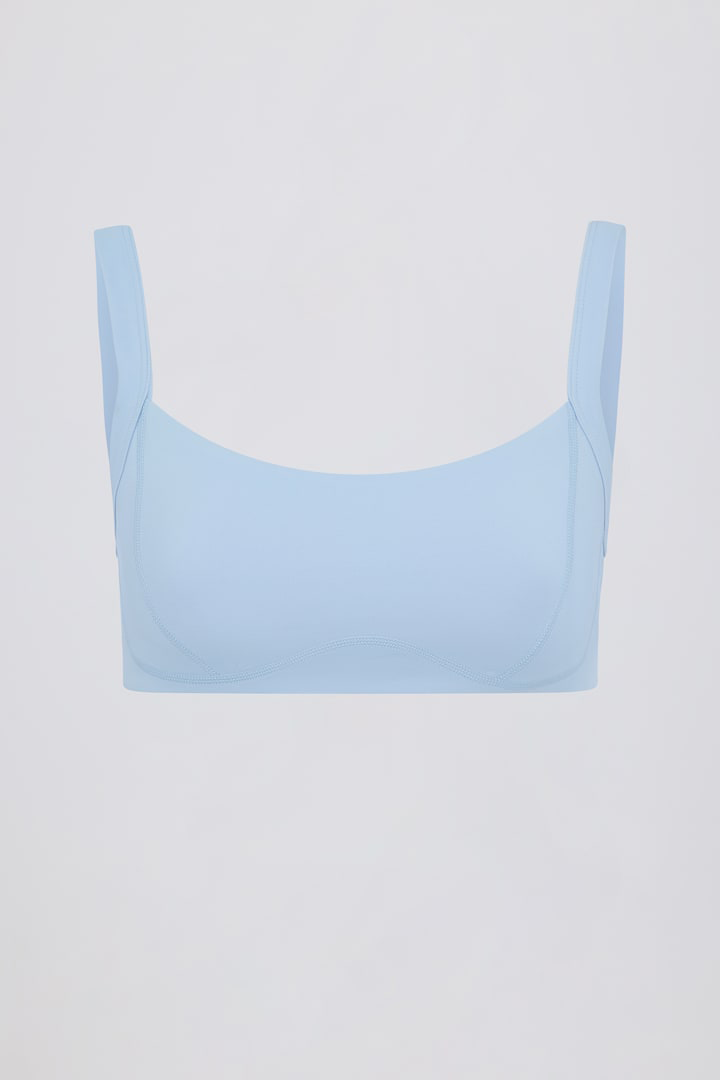 sky blue sports bra, contrast trim yoga bra, soft activewear top, women’s fitness bra, scoop neck workout bra