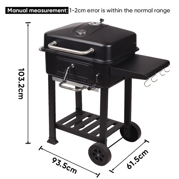 charcoal grill in black with offset smoker and side table