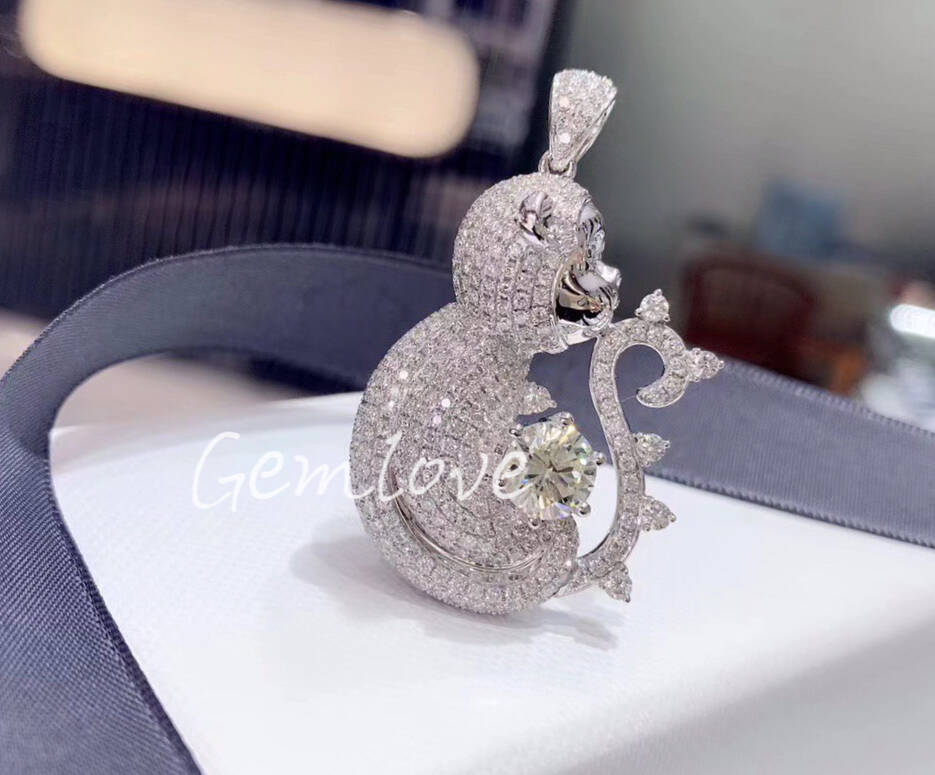 18k gold monkey pendant, intricately adorned with natural diamonds