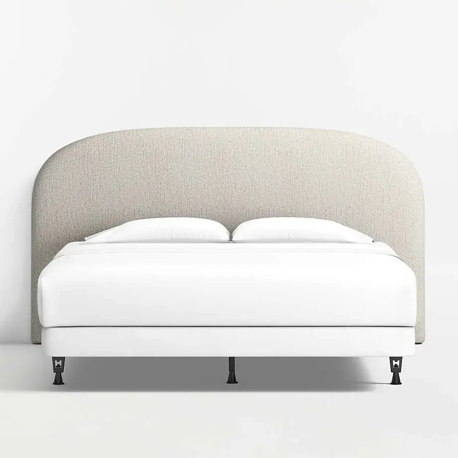 Bulk supply of rounded upholstered headboards with padded support and textured fabric. Durable, stylish, and customizable, perfect for hotels, apartments, and large residential projects.