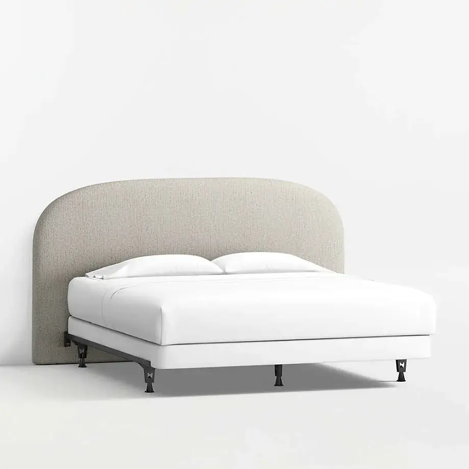 Bulk supply of rounded upholstered headboards with padded support and textured fabric. Durable, stylish, and customizable, perfect for hotels, apartments, and large residential projects.
