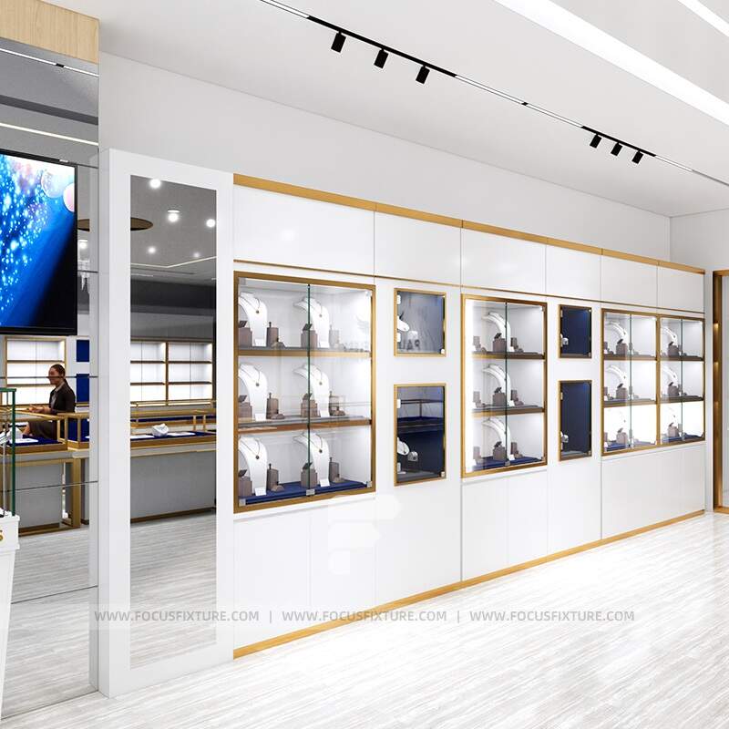 jewelry showcases; glass display cases; customizable design; white display case; gold frame showcase; retail presentation; elegant jewelry display